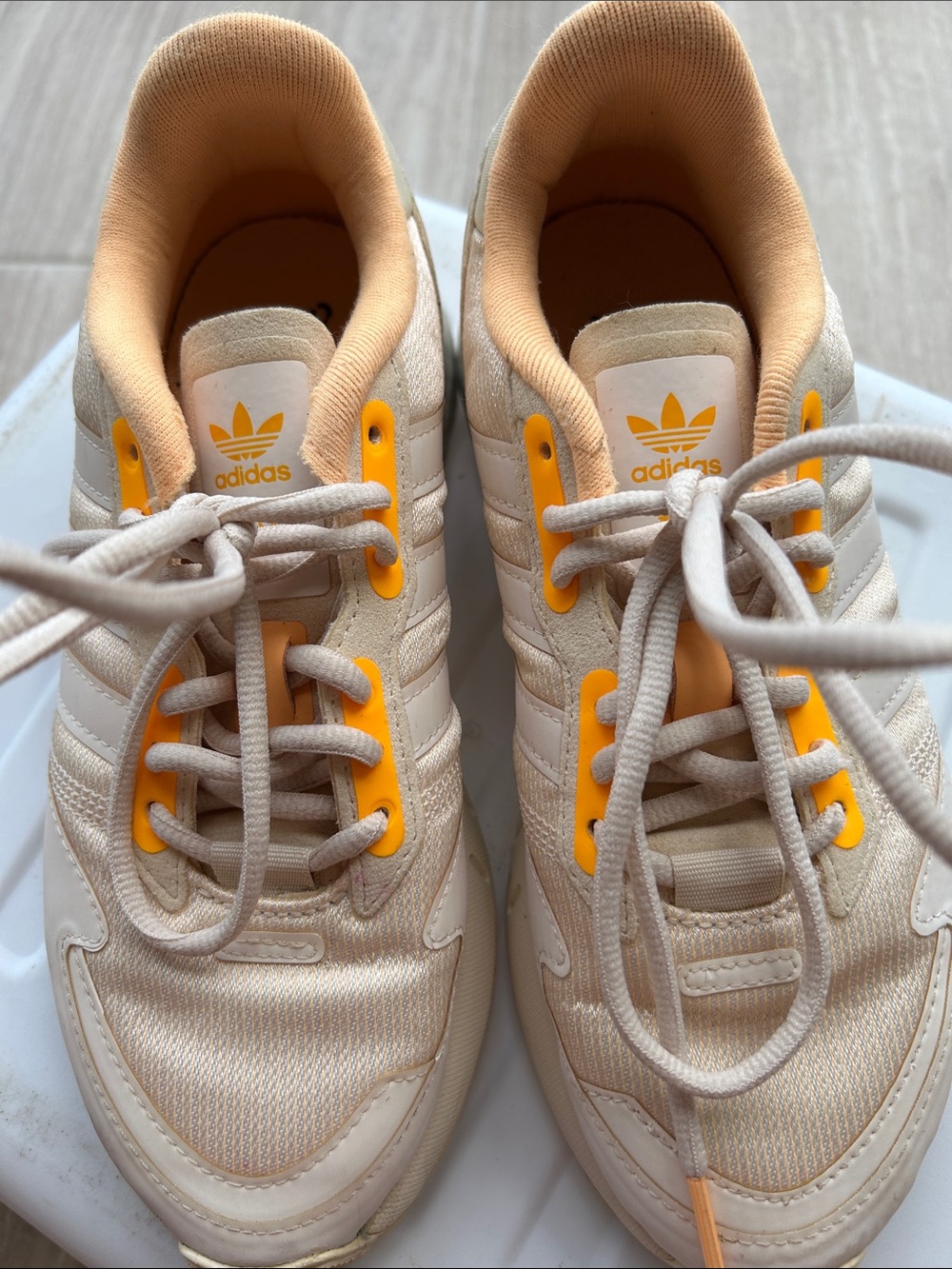 adidas Beige Sneakers with Yellow Eyelet Accents